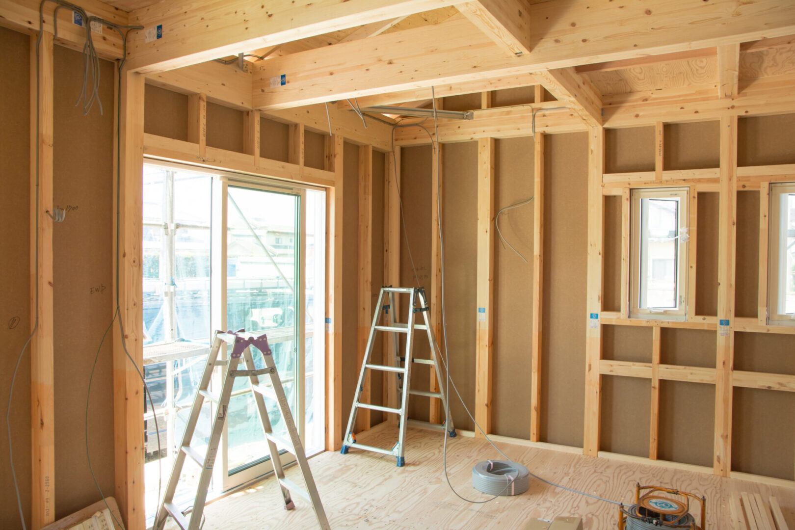 Interior construction site with wooden framework.